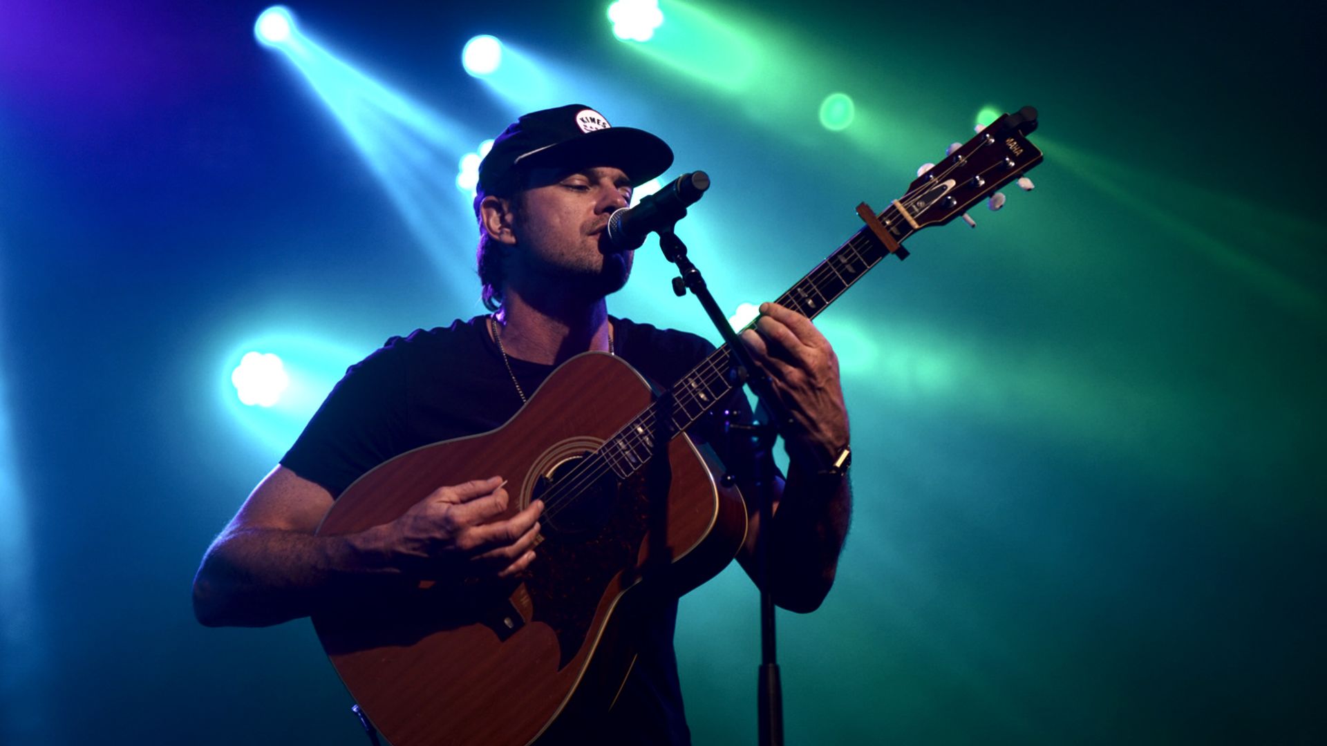 A Person Playing A Guitar