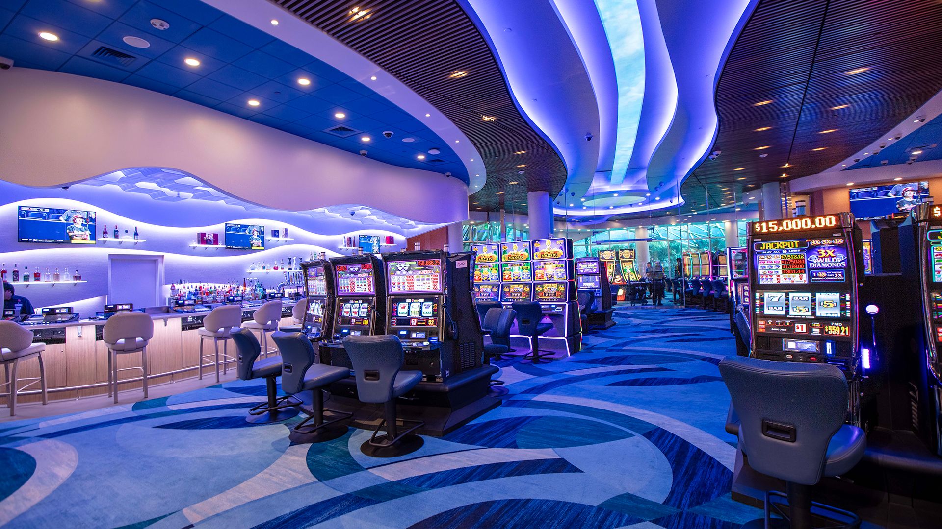 A Room With A Large Screen And Chairs