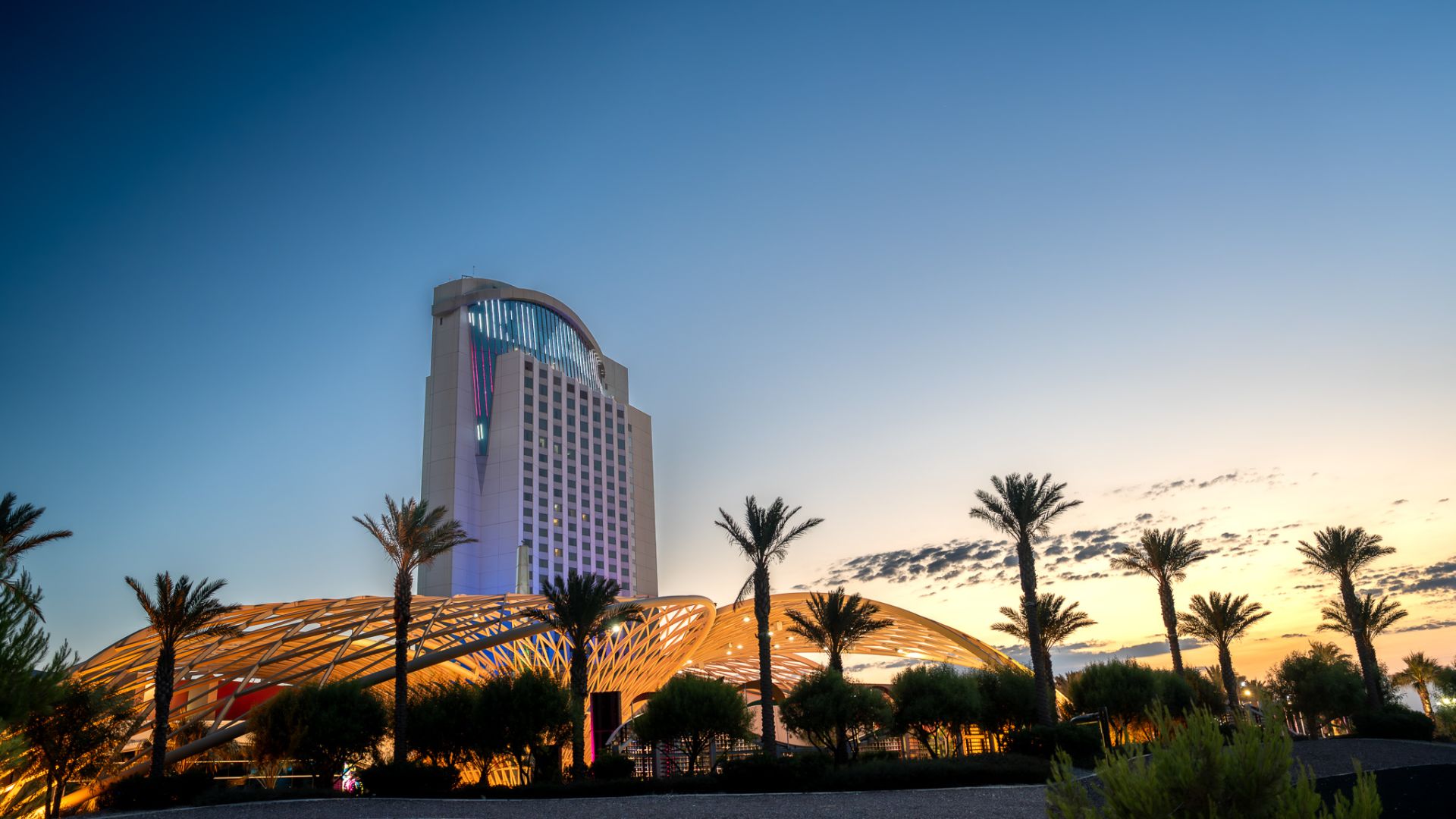 A Tall Building With A Glass Front
